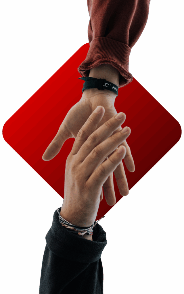 Two hands in front of a red background